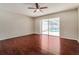 Bedroom features wood floors and a sliding glass door leading to the pool area at 8506 Moulton Dr, Port Richey, FL 34668