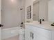Beautiful bathroom featuring a modern vanity, sleek fixtures, and stylish tile work adding a touch of elegance at 3339 Elkcam Blvd, Port Charlotte, FL 33952