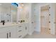 Stylish bathroom with double vanity, white cabinets, and sleek fixtures at 3339 Elkcam Blvd, Port Charlotte, FL 33952
