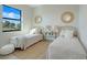 Comfortable bedroom featuring two twin beds and a well-lit space, perfect for guests or  at 3339 Elkcam Blvd, Port Charlotte, FL 33952