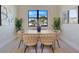 Stylish dining room featuring modern chairs, a window, and neutral décor at 3339 Elkcam Blvd, Port Charlotte, FL 33952