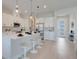 Well-lit, modern kitchen with stainless steel appliances and a breakfast bar at 3339 Elkcam Blvd, Port Charlotte, FL 33952