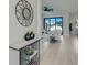 Open-concept layout with views from the foyer to a living area with sliding doors to the backyard at 3339 Elkcam Blvd, Port Charlotte, FL 33952