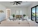 Light-filled living room with contemporary decor, a ceiling fan, and neutral color scheme at 3339 Elkcam Blvd, Port Charlotte, FL 33952