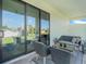 Inviting outdoor patio with modern seating ideal for relaxing and enjoying the natural surroundings at 3339 Elkcam Blvd, Port Charlotte, FL 33952