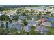 An aerial view of the residential neighborhood, showcasing houses with landscaped yards and a central cul-de-sac at 5009 72Nd E Ct, Bradenton, FL 34203