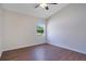 Bright bedroom with hardwood floors and a ceiling fan at 5009 72Nd E Ct, Bradenton, FL 34203