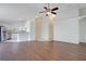 Spacious open-concept living room with hardwood floors and seamless flow into the kitchen at 5009 72Nd E Ct, Bradenton, FL 34203