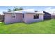 Lush backyard featuring a well-manicured lawn at 7221 King Arthur Dr, Port Richey, FL 34668