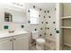 Bright bathroom featuring white fixtures and tile accents at 7221 King Arthur Dr, Port Richey, FL 34668