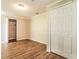 Clean bedroom featuring laminate floors and closet at 7221 King Arthur Dr, Port Richey, FL 34668