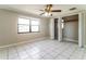 Well lit bedroom with large window and closet at 7221 King Arthur Dr, Port Richey, FL 34668