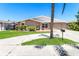 Charming single-story home featuring a well-maintained lawn, driveway, and attached garage at 7221 King Arthur Dr, Port Richey, FL 34668