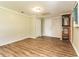 Spacious bonus room with laminate floors, closet, and water heater at 7221 King Arthur Dr, Port Richey, FL 34668