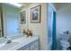Cozy bathroom featuring a sink, toilet, and shower with tile floors at 9475 Dunkirk Rd, Spring Hill, FL 34608