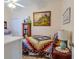 Cozy bedroom featuring a comfortable bed and a colorful quilt at 9475 Dunkirk Rd, Spring Hill, FL 34608