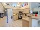 Bright kitchen with light wood cabinets, stainless steel appliances, and ample counter space at 9475 Dunkirk Rd, Spring Hill, FL 34608