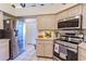 Modern kitchen with stainless steel appliances and bright wooden cabinetry at 9475 Dunkirk Rd, Spring Hill, FL 34608