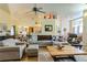 Inviting living room with an open floor plan, ceiling fan and hardwood flooring at 9475 Dunkirk Rd, Spring Hill, FL 34608