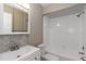 The bathroom features a tub and shower combination and marble backsplash at 2597 Countryside Blvd # 204, Clearwater, FL 33761