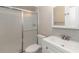 Bathroom featuring white vanity, toilet, and glass-enclosed shower at 2597 Countryside Blvd # 204, Clearwater, FL 33761