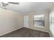 Bedroom featuring new floors, natural light, and neutral paint at 2597 Countryside Blvd # 204, Clearwater, FL 33761