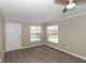 Bedroom featuring new floors, natural light, and neutral paint at 2597 Countryside Blvd # 204, Clearwater, FL 33761