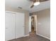 This bedroom offers a standard closet with neutral paint at 2597 Countryside Blvd # 204, Clearwater, FL 33761