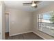 This bedroom provides natural light and wood-look floors at 2597 Countryside Blvd # 204, Clearwater, FL 33761