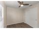 This simple bedroom features wood-look flooring, a ceiling fan, and a closet at 2597 Countryside Blvd # 204, Clearwater, FL 33761