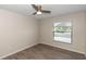 Bedroom featuring neutral paint, wood-look floors, and natural light at 2597 Countryside Blvd # 204, Clearwater, FL 33761