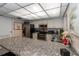 Charming kitchen features stainless steel appliances, granite countertops, and ample cabinet space at 2597 Countryside Blvd # 204, Clearwater, FL 33761