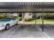 Assigned covered parking space for residents near the building entrance to protect your vehicle from the elements at 2597 Countryside Blvd # 204, Clearwater, FL 33761