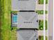 Aerial view of a home with a screened-in pool and backyard at 3061 Hollow Hickory Pl, Wesley Chapel, FL 33543