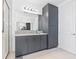 Elegant bathroom featuring granite countertops, modern lighting, and a glass-enclosed shower at 3061 Hollow Hickory Pl, Wesley Chapel, FL 33543