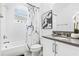 Contemporary bathroom features marble shower curtain and neutral decor at 3061 Hollow Hickory Pl, Wesley Chapel, FL 33543
