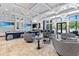 Beautiful clubhouse interior featuring stylish seating arrangements and large windows at 3061 Hollow Hickory Pl, Wesley Chapel, FL 33543
