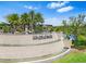 Elegant community entrance with water feature and landscaping at Winding Ridge, Wesley Chapel, Florida at 3061 Hollow Hickory Pl, Wesley Chapel, FL 33543