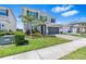 Charming two-story home boasts a manicured lawn, a two-car garage, and a beautifully landscaped yard at 3061 Hollow Hickory Pl, Wesley Chapel, FL 33543