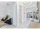 Bright and airy hallway features modern decor, sleek lighting, and stylish accents at 3061 Hollow Hickory Pl, Wesley Chapel, FL 33543