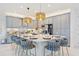 Kitchen featuring gray cabinets, stainless steel appliances, pendant lighting and large island at 3061 Hollow Hickory Pl, Wesley Chapel, FL 33543