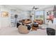 Comfortable living room with stylish decor, wood paneling, and ample seating at 3061 Hollow Hickory Pl, Wesley Chapel, FL 33543