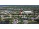 Aerial view showing the location of a house in a community near a recreation center and a pond surrounded by nature at 12802 Cattail Shore Ln, Riverview, FL 33579