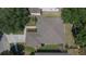 Overhead aerial view reveals a meticulously maintained roof, trimmed lawn, and landscaped yard of a beautiful single-Gathering home at 12802 Cattail Shore Ln, Riverview, FL 33579