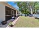 Home's backyard with lawn, patio and lush landscaping at 12802 Cattail Shore Ln, Riverview, FL 33579
