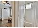 Bathroom with shower/tub combo and view of baseball themed bedroom at 12802 Cattail Shore Ln, Riverview, FL 33579