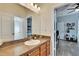 Bathroom featuring vanity sink, mirror, and tile floors at 12802 Cattail Shore Ln, Riverview, FL 33579