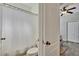 Bathroom with toilet and shower/tub combo with a white shower curtain at 12802 Cattail Shore Ln, Riverview, FL 33579