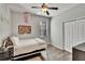 Bedroom with wood floors, fan, and closet at 12802 Cattail Shore Ln, Riverview, FL 33579