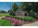 Welcoming Summer Springs community sign surrounded by beautiful flowers and greenery at 12802 Cattail Shore Ln, Riverview, FL 33579
